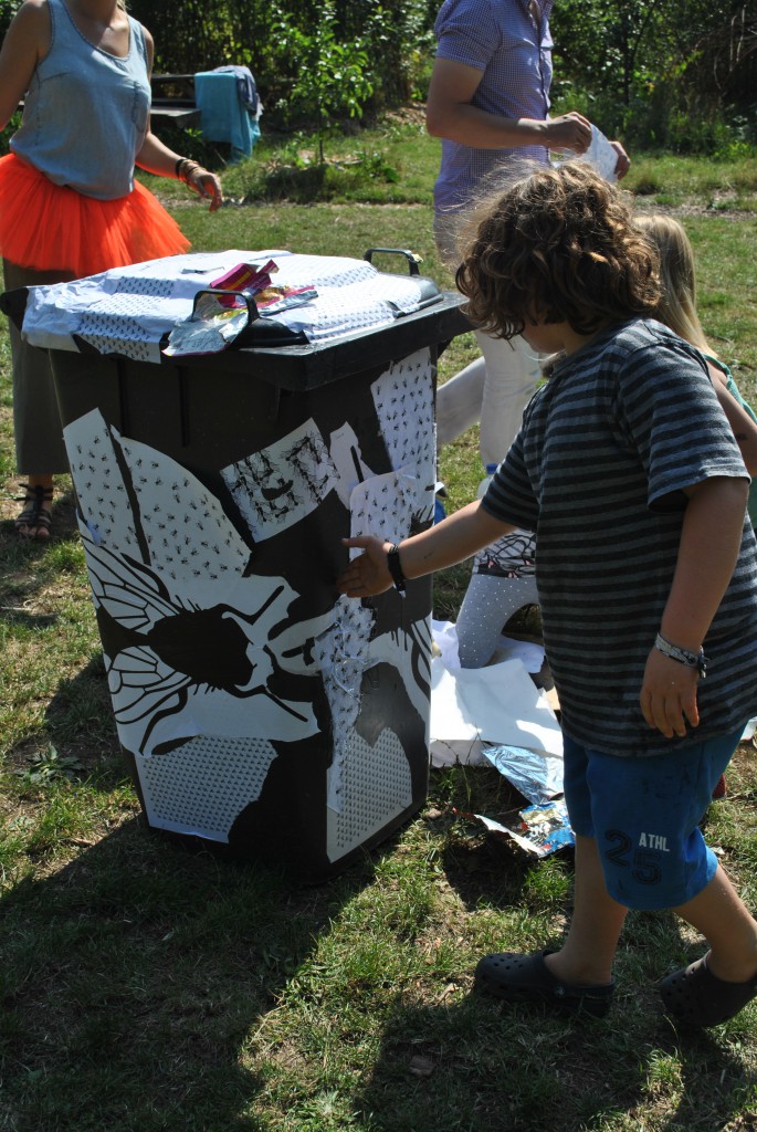 Kids making their marks using the stencils of The Fly, exploring stencil work. 